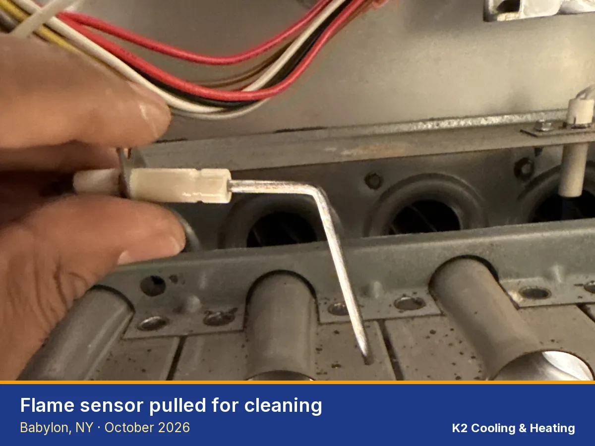 Furnace flame sensor removed for cleaning in Babylon