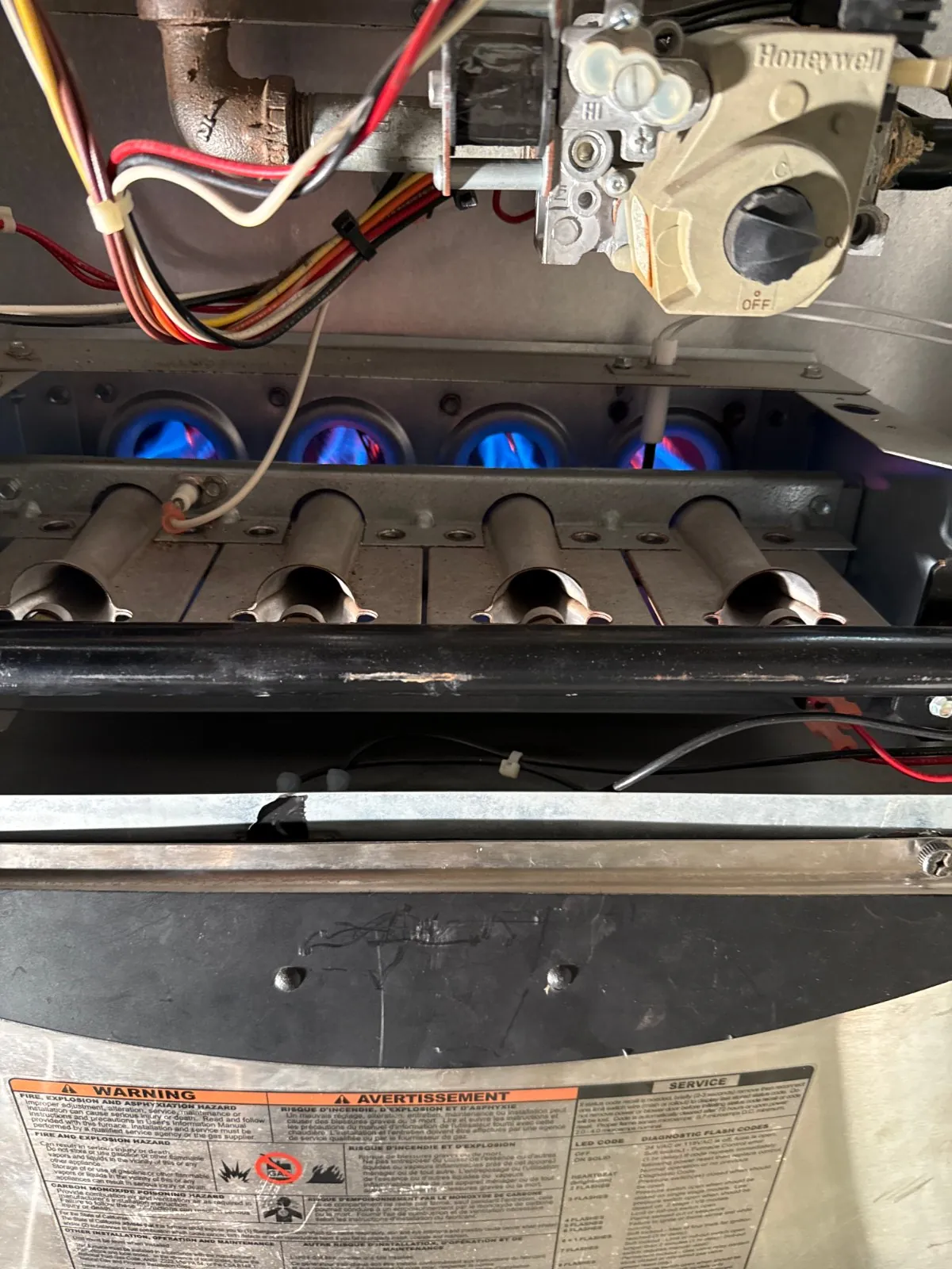 Gas burners firing during a furnace tune-up, Babylon NY