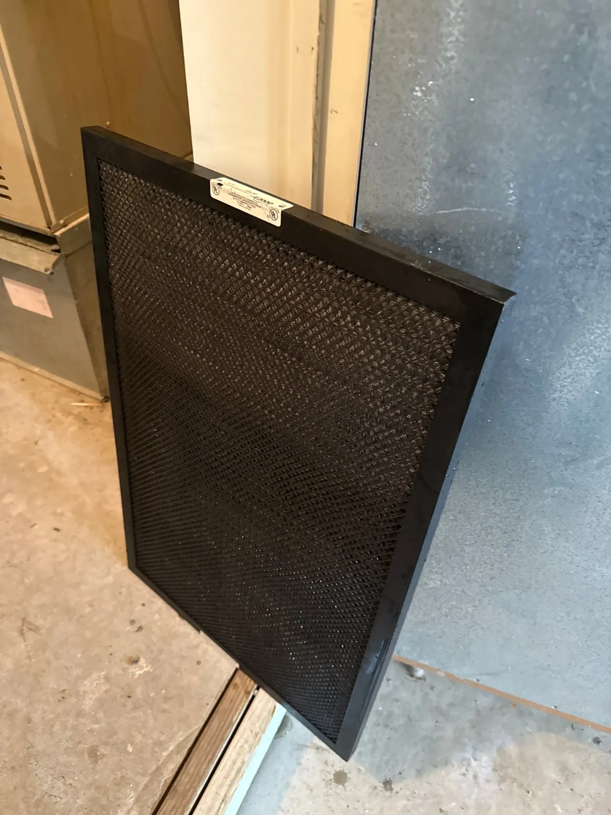 Air filter checked on the first-floor system, Commack NY