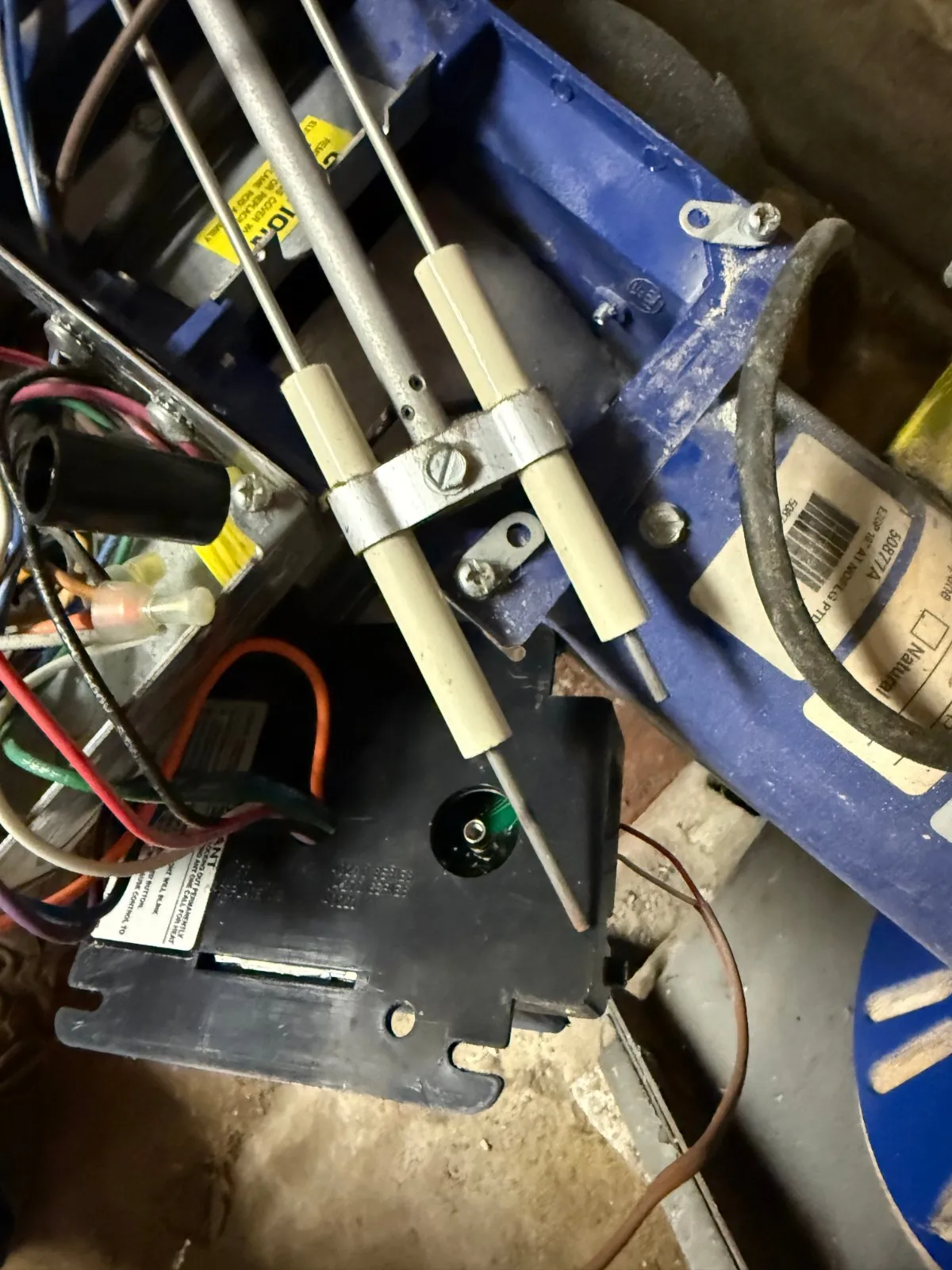 Burner ignition electrodes checked during the tune-up