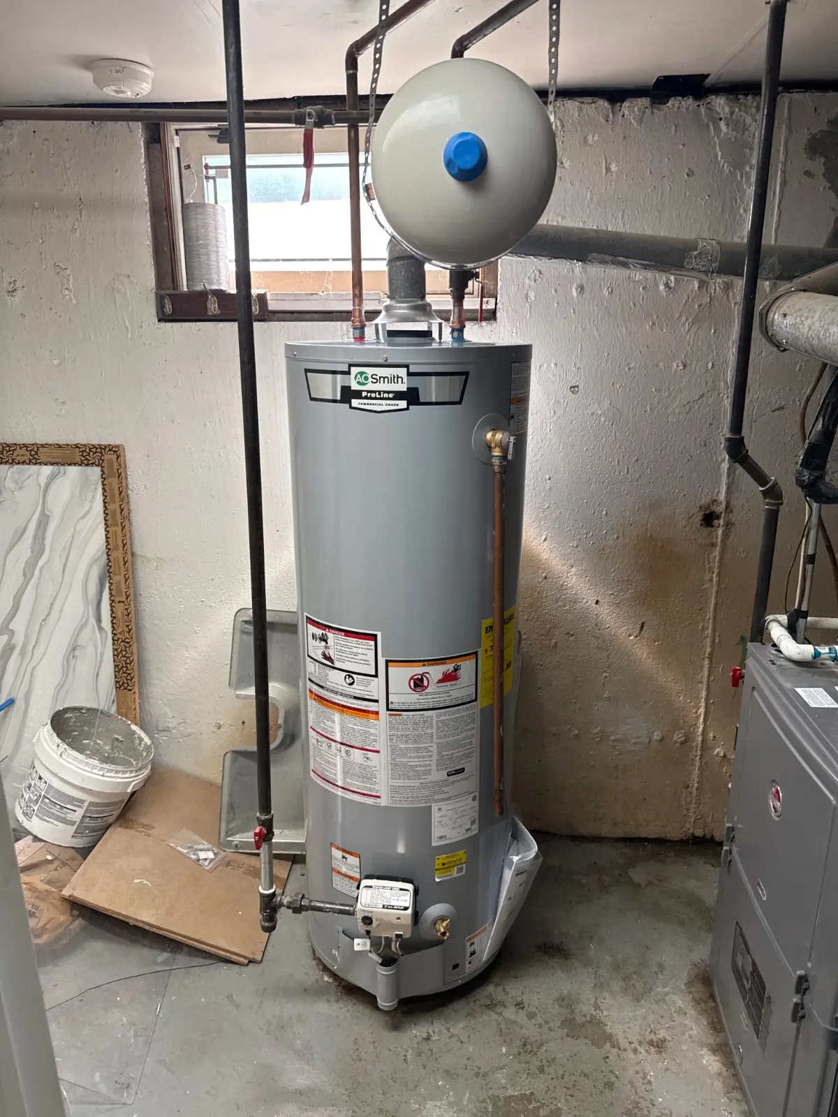 New 40-gallon direct-vent gas water heater in a basement, East Meadow NY