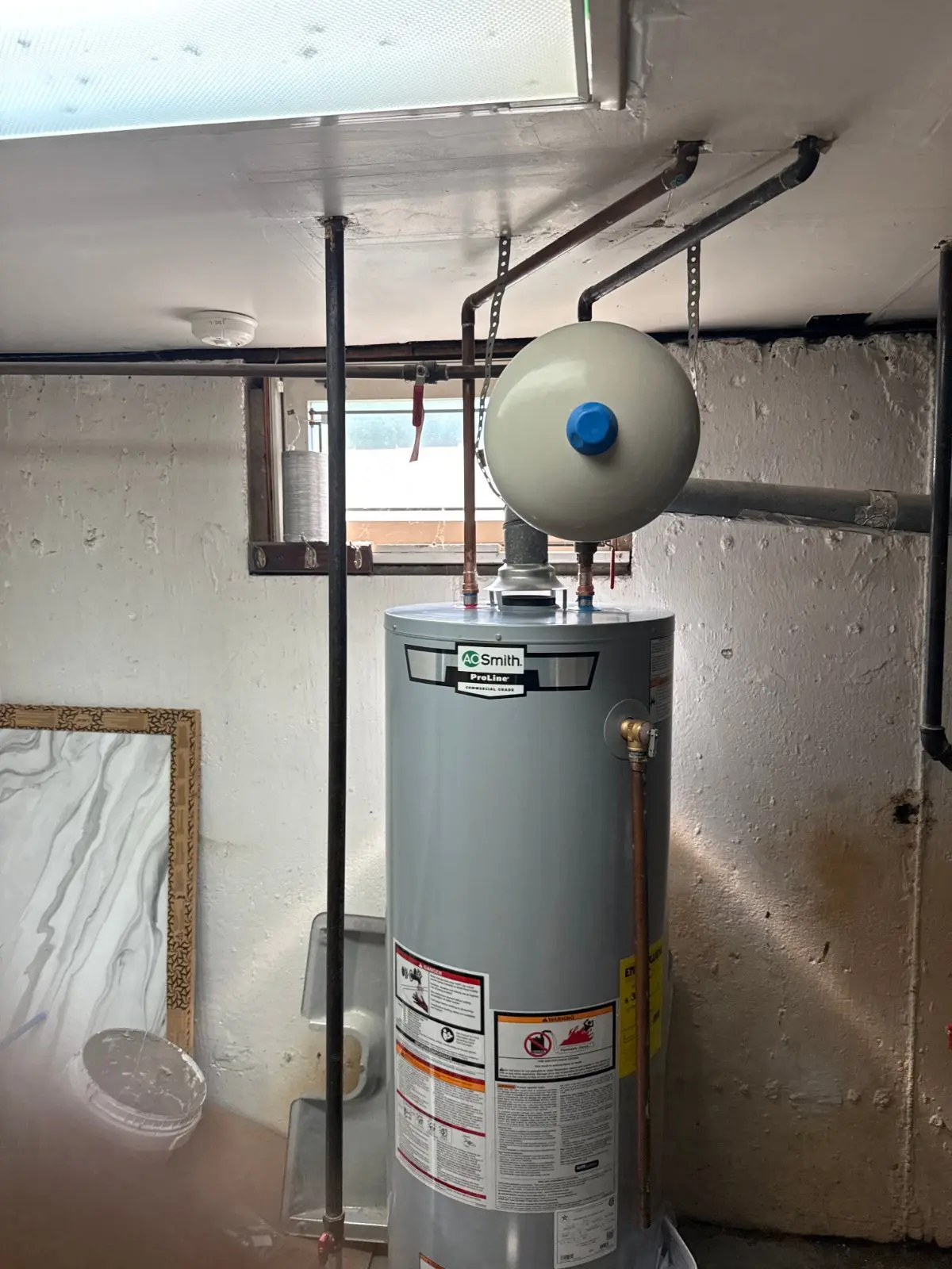 New water heater with its venting and piping connected, East Meadow NY