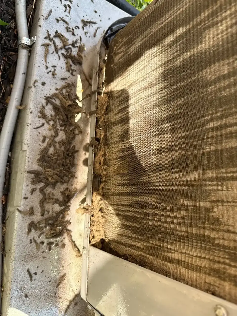 Debris packed against the condenser coil, Hauppauge NY