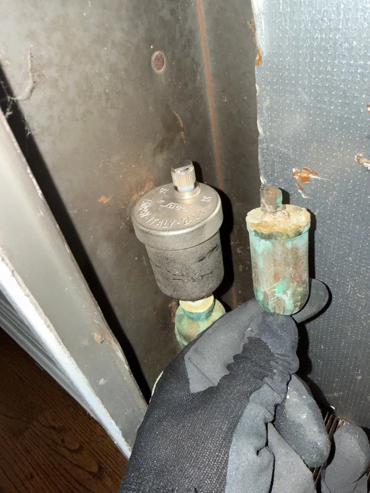 Old leaking air bleeder next to the new one, Huntington NY