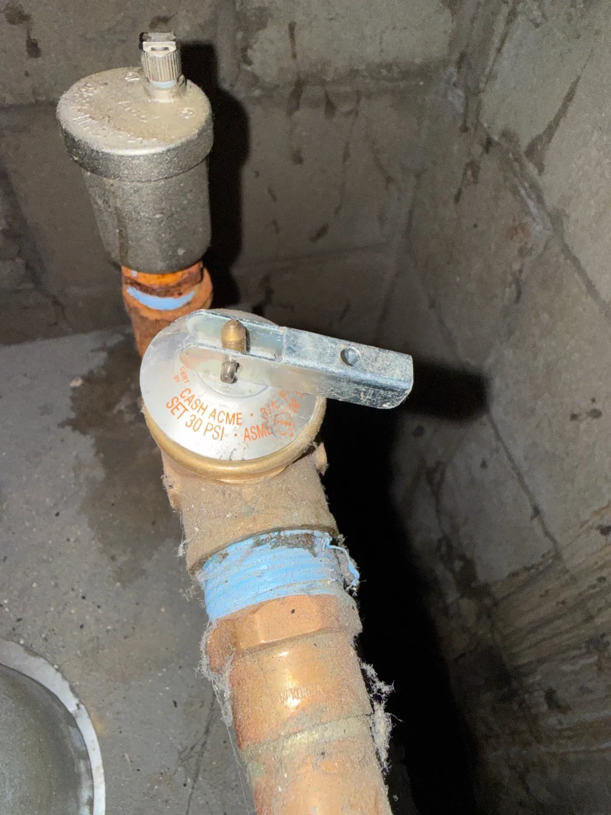 Water feed and relief valve piping on the boiler