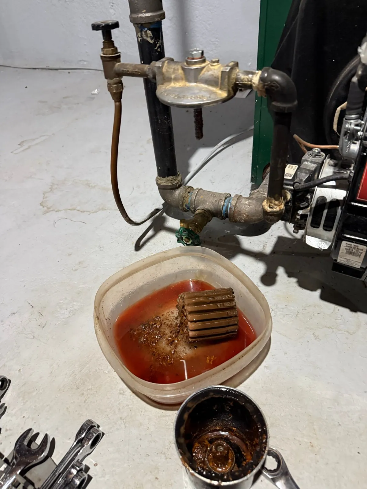 Old oil filter removed during the tune-up