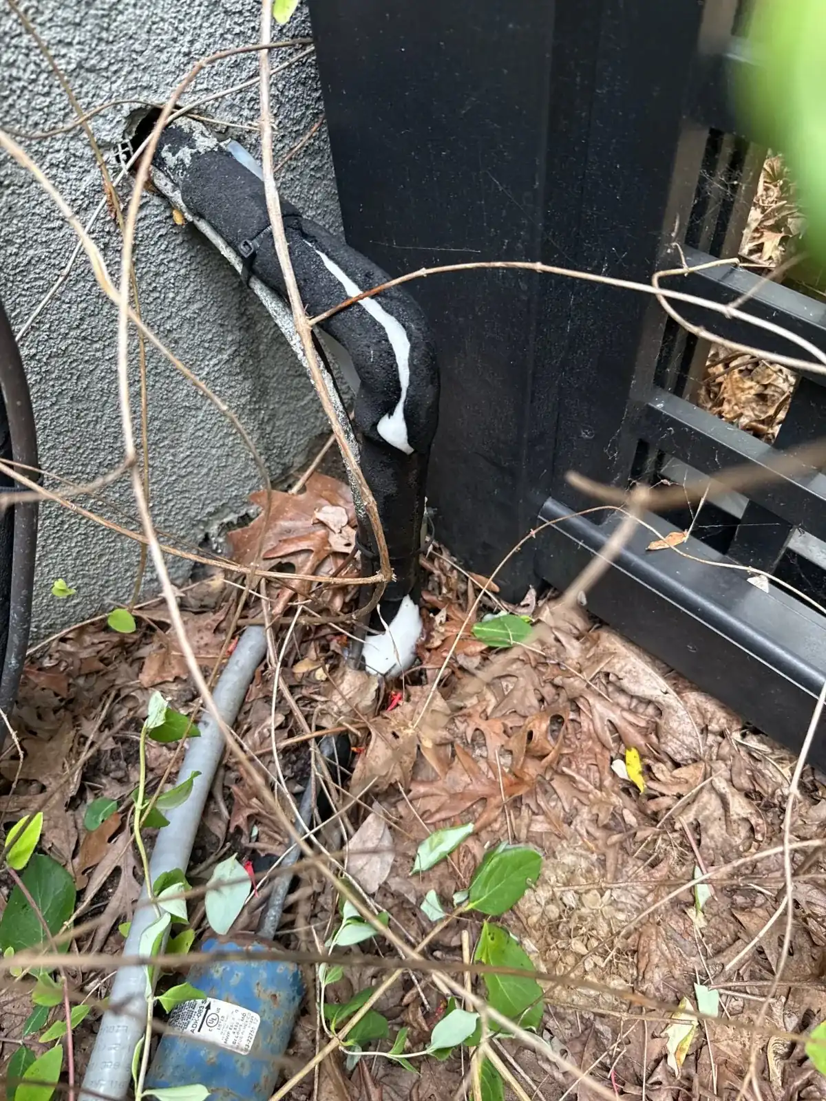 Outdoor air conditioning equipment beside a Northport home